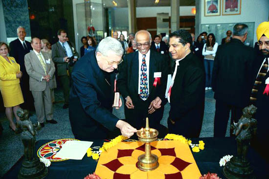 Archbishop Pietro Sambi lights a lamp to honor a Hindu deity